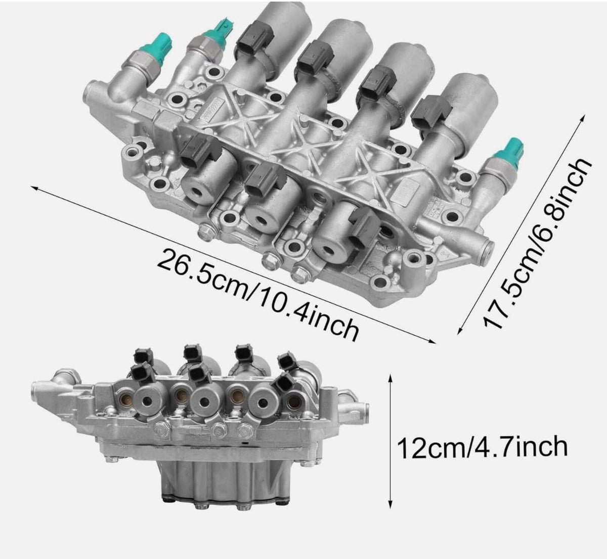 Vehicle valve body assembly in angled view with multiple solenoids and green fittings