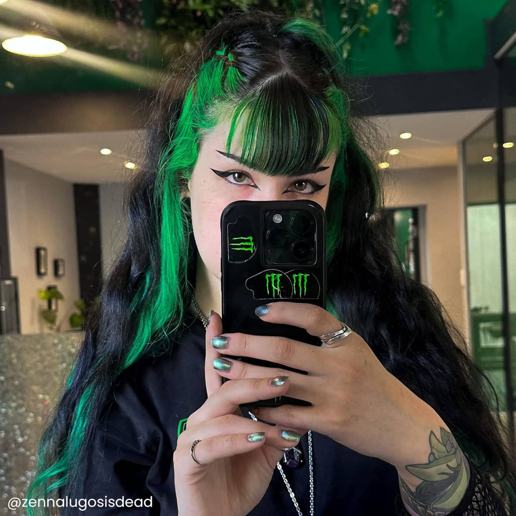 Semi-permanent Phantom Green hair color with dark hair and green streaks