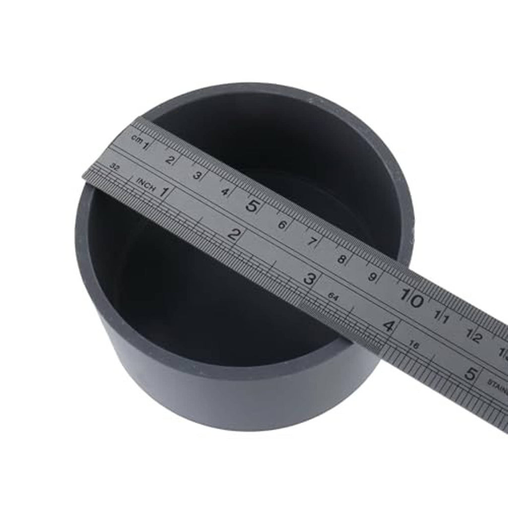 Round PVC pipe end cap plug, dark gray, sized with ruler