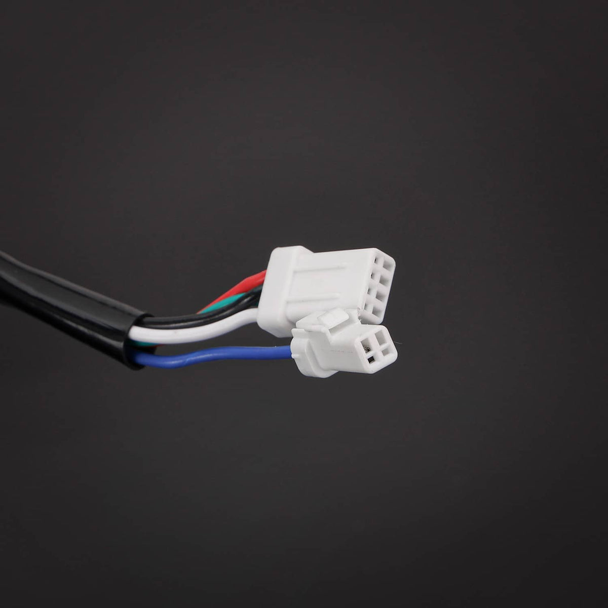 Pre-wired handlebar wiring harness with white connector and bundled colored leads