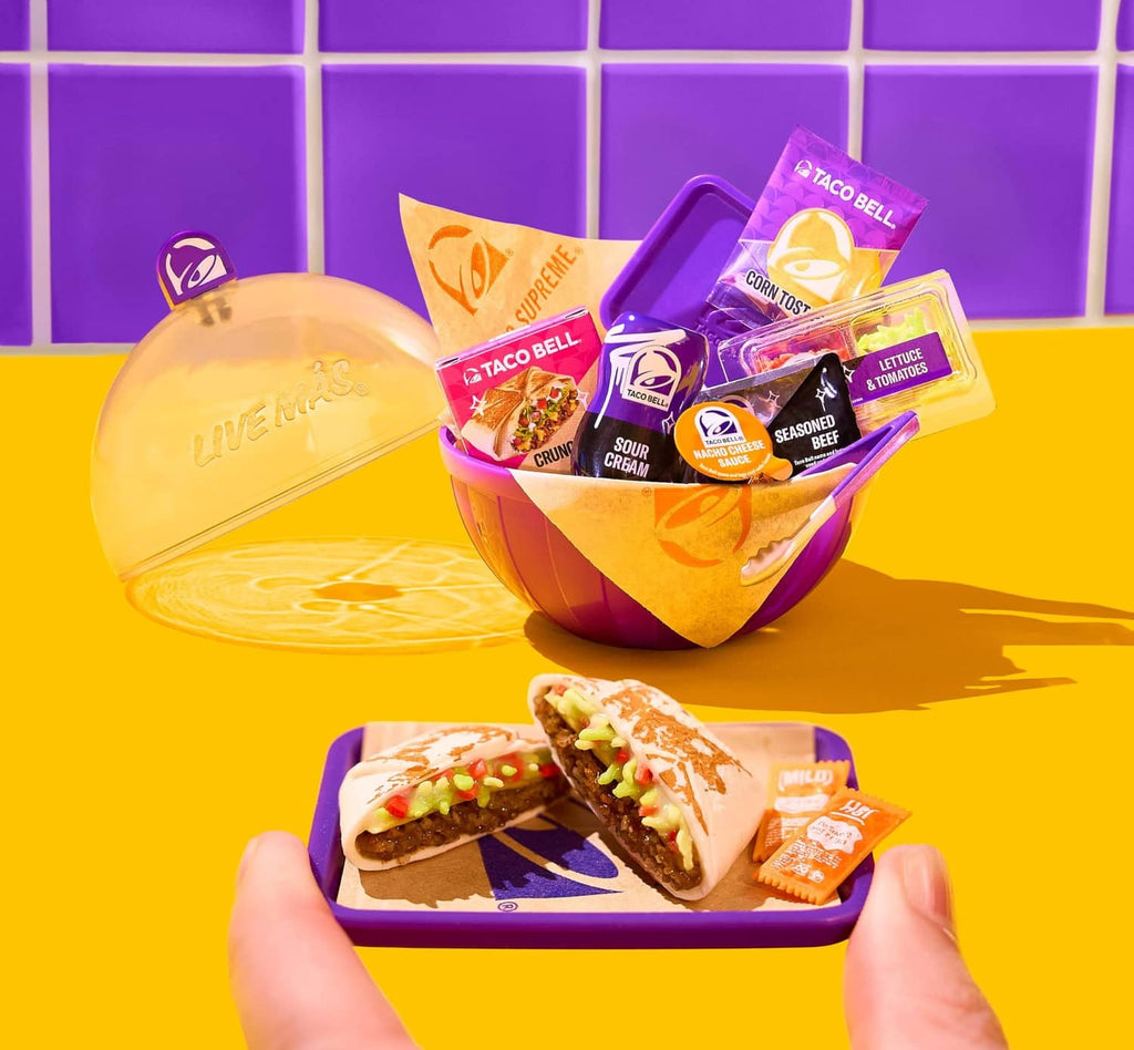 Mini Taco Bell mini food in purple bowl with folded tortilla and condiment packets