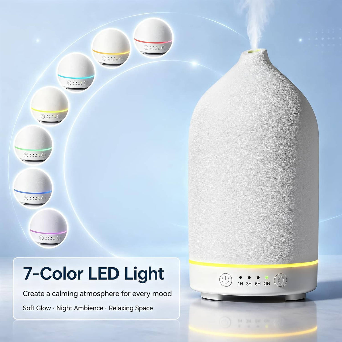 White ceramic essential oil diffuser with multi-color LED lighting and glowing mist.