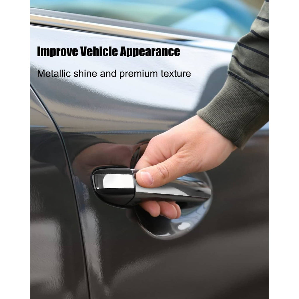 Exterior rear door handle with chrome insert and black outer grip
