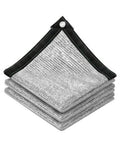 Stacked reflective aluminum shade cloth panels with black reinforced corners and grommets
