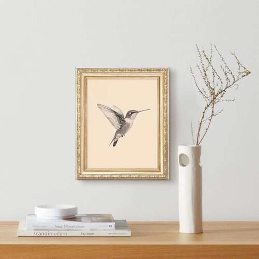 Ornate gold 8x10 picture frame with bird illustration, square border and glass front