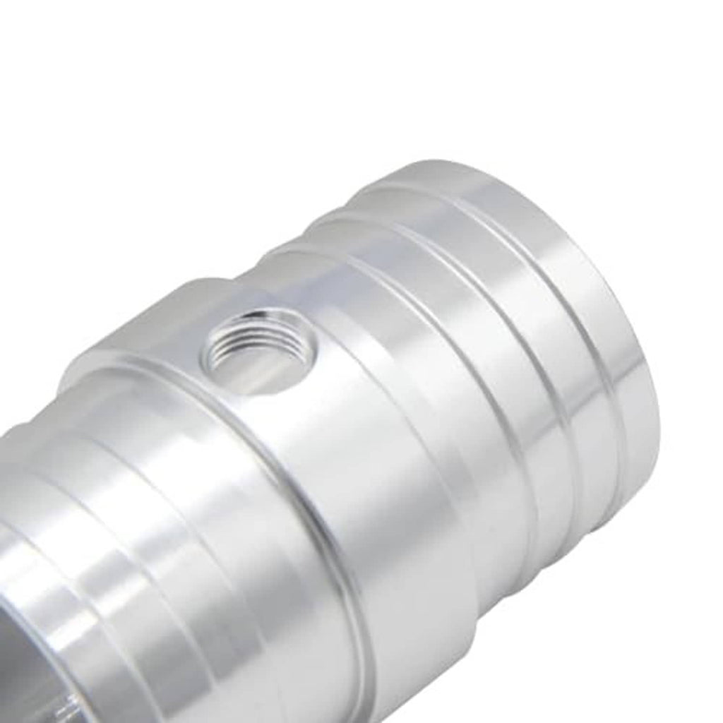 Close-up of radiator hose barb adapter body with band seams and threaded NPT port, silver.