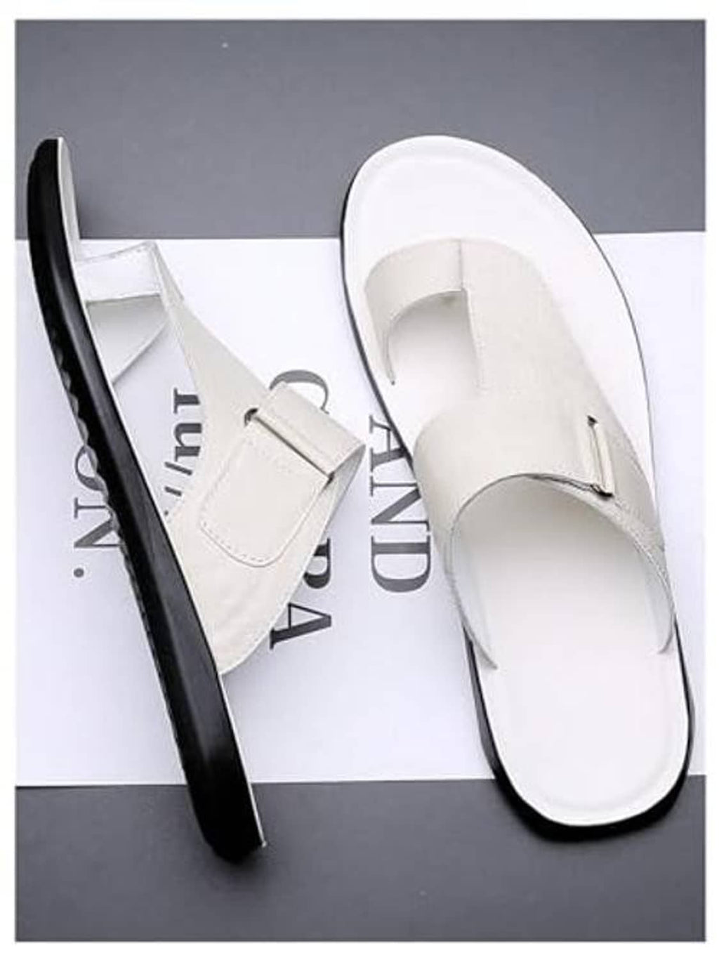 Pair of white thong sandals, open toe slip-on style with front strap and black edge