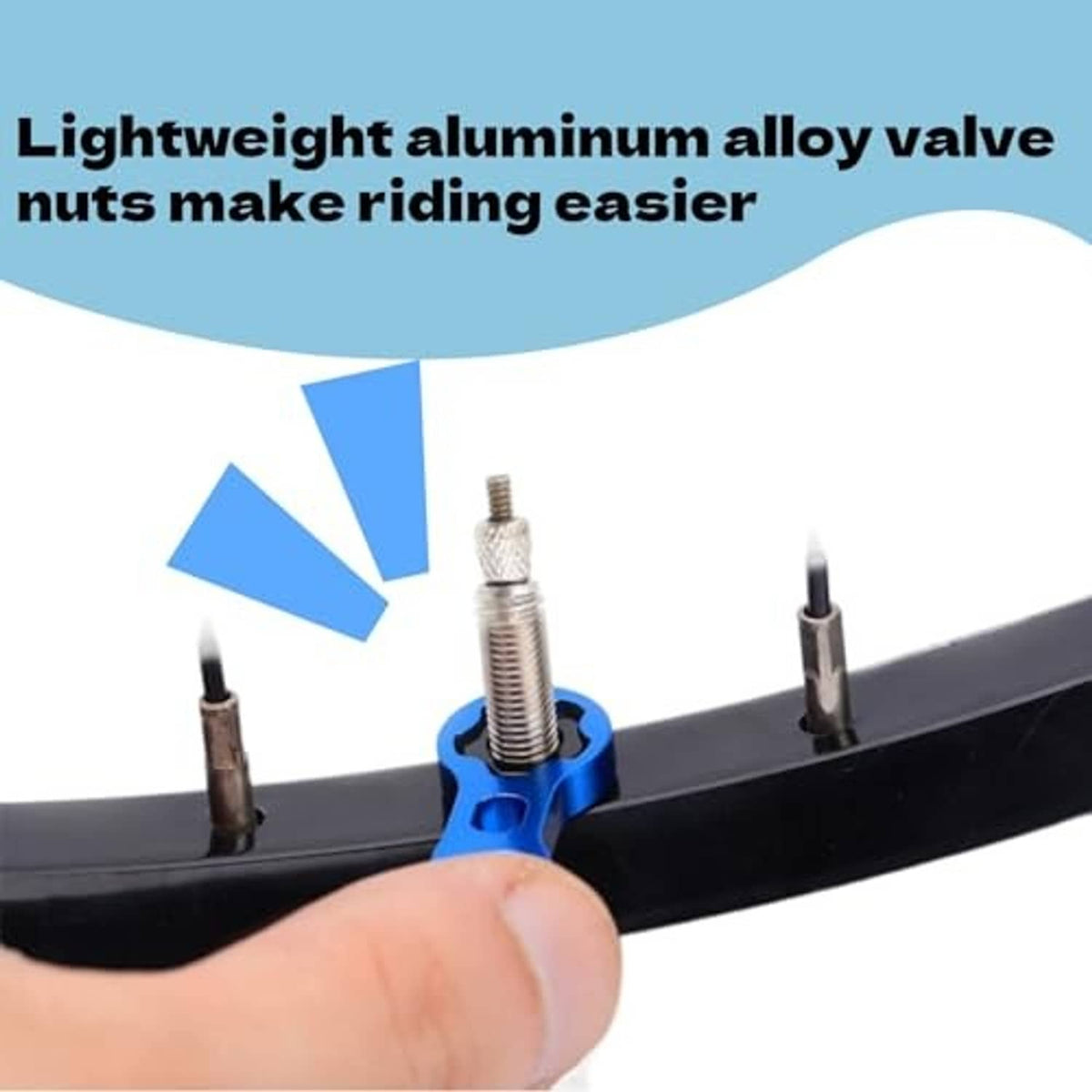 Blue wrench tightening a bicycle valve nut on a tire valve stem