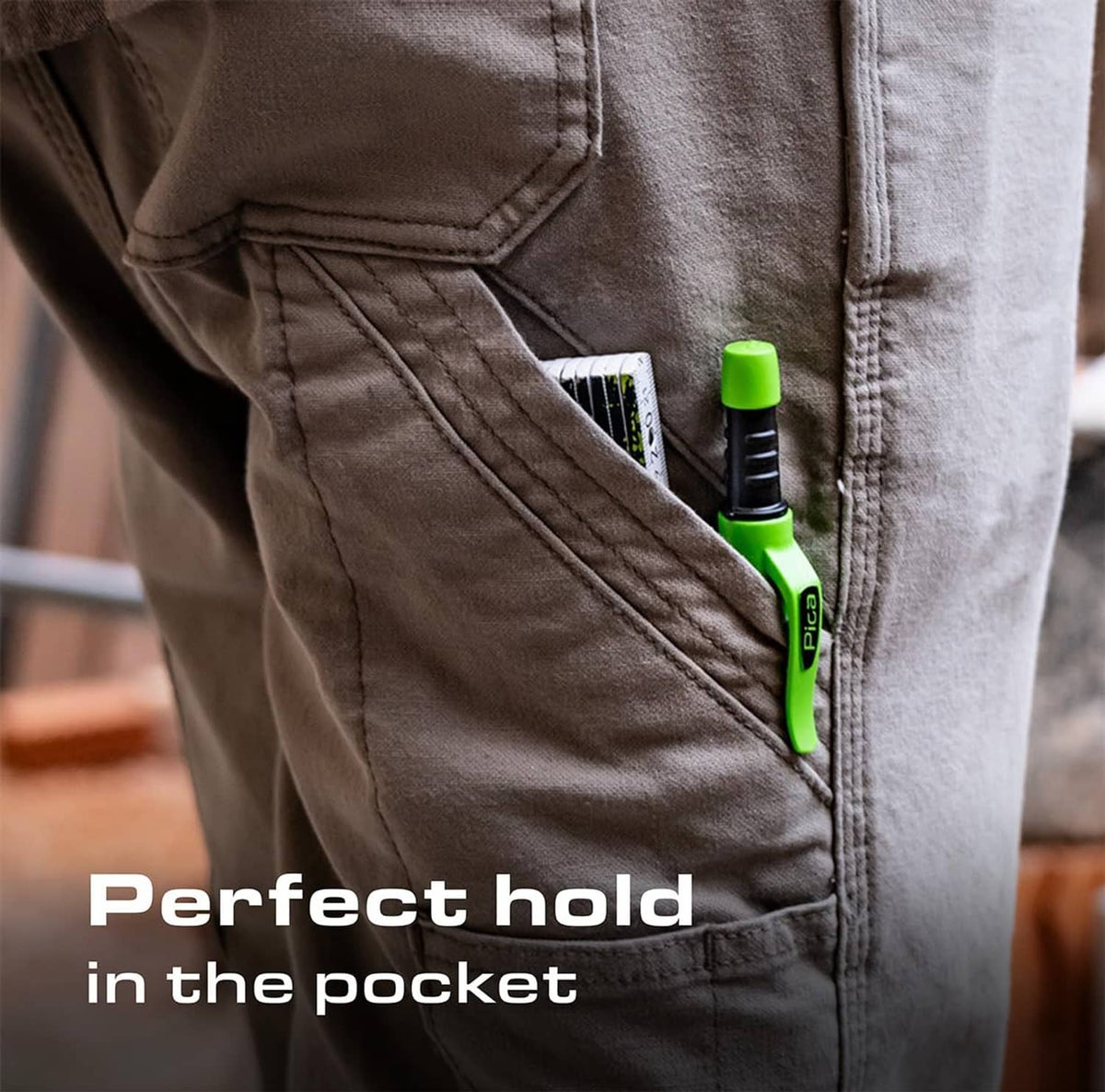 Automatic pencil clipped inside a pants pocket with green end visible