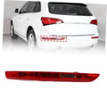 Left rear bumper tail light bar with red lens, mounted on the rear of a white car