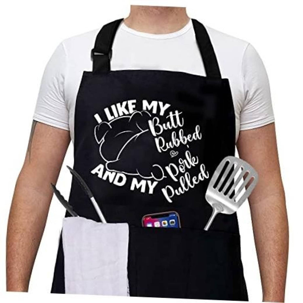 Black grilling apron with cartoon text, spatula and fork print, adjustable neck strap