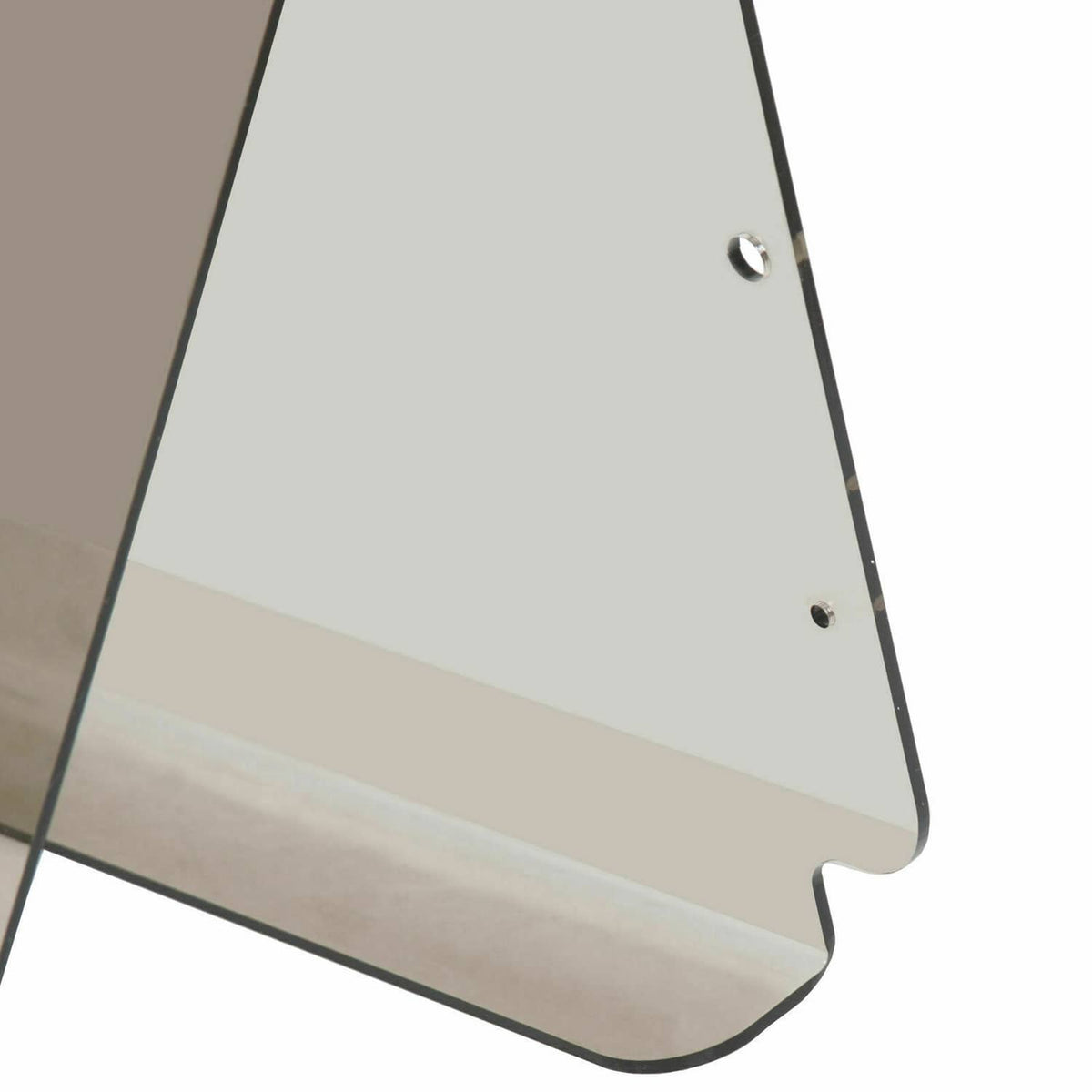 Tinted windshield panel corner with mounting holes and black trim edge