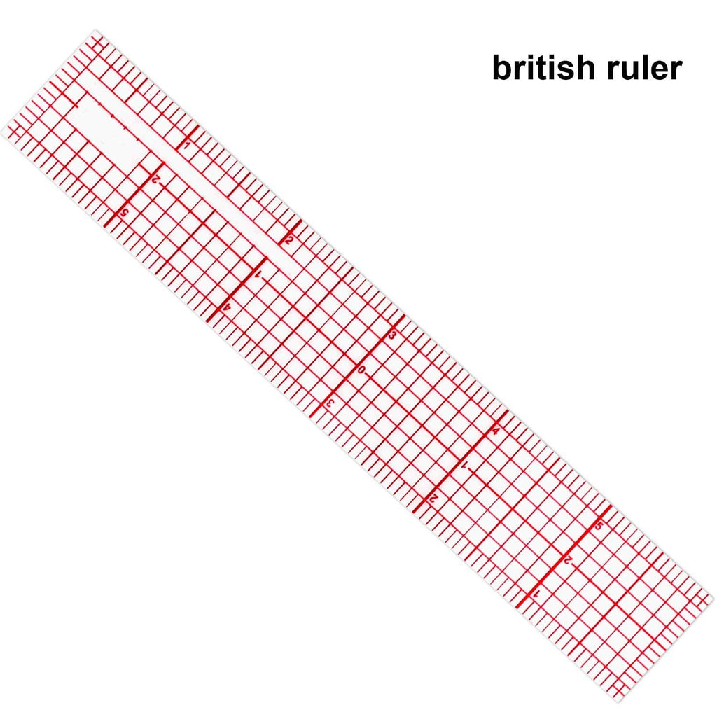 Clear plastic grid ruler with red inch markings and straight edge, diagonally shown