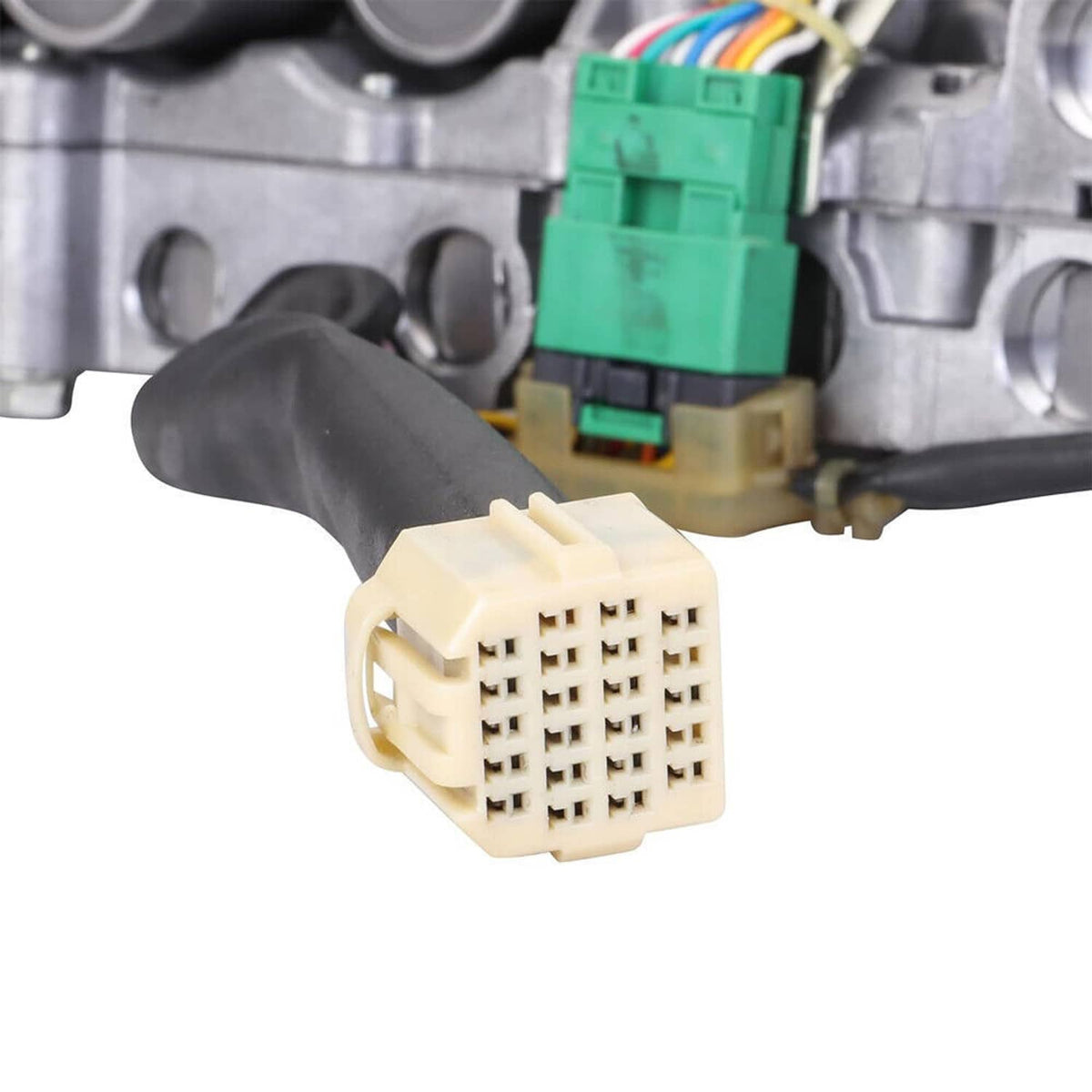 CVT valve body electrical connector plug on wiring harness, close-up with metal housing.