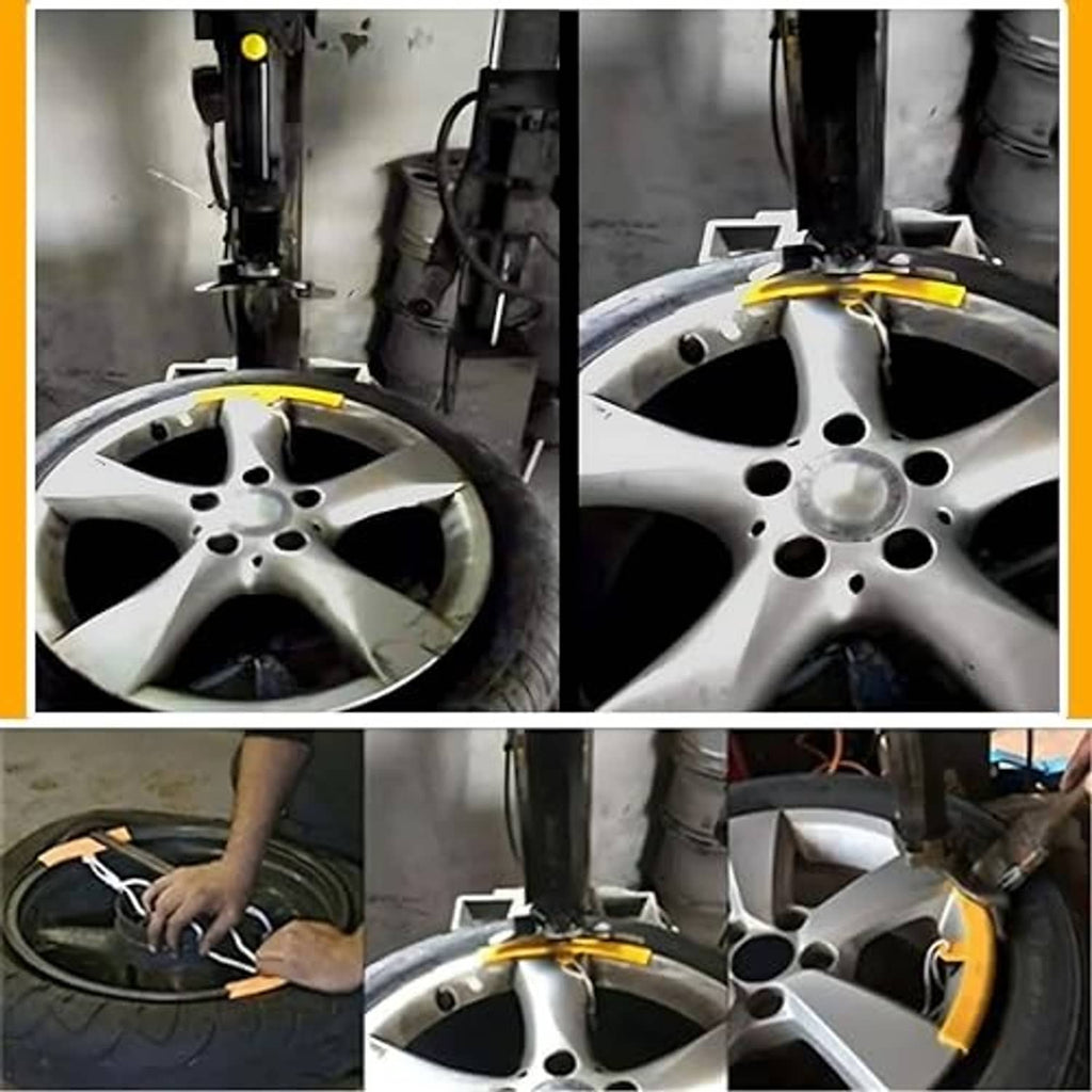 Orange rim protector guards placed on a silver alloy wheel rim during tire changing