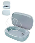 Blue charging case with lid open, showing inner charging cradle for compatible rings