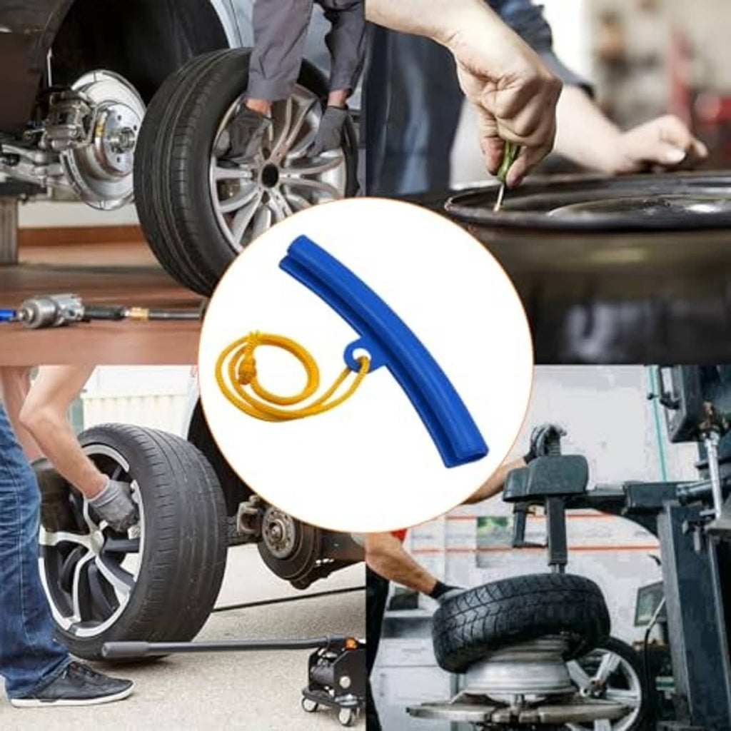 Blue rim protector with yellow cord used on a car wheel during service