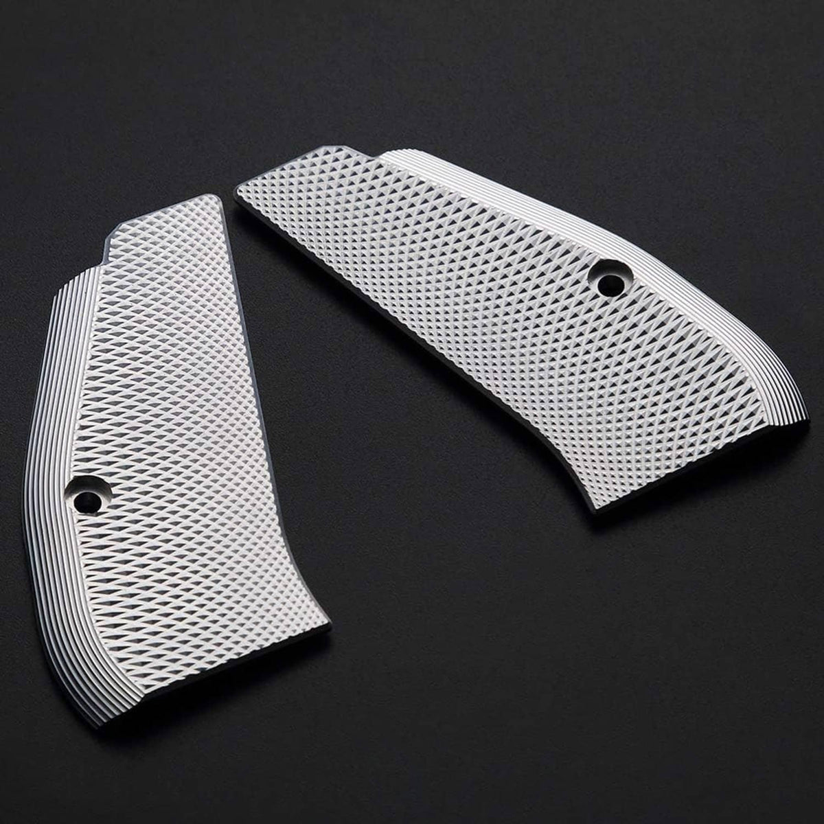 Two aluminum pistol grip panels with diamond checkered texture and circular mounting holes