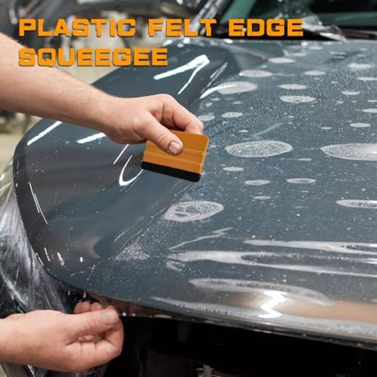 Vinyl squeegee with orange handle and black felt edge smoothing car window film