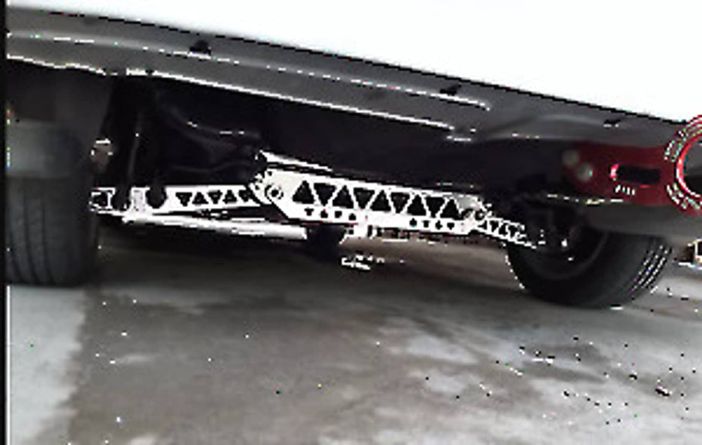 Undercar silver subframe brace tie bar with triangular cutout pattern
