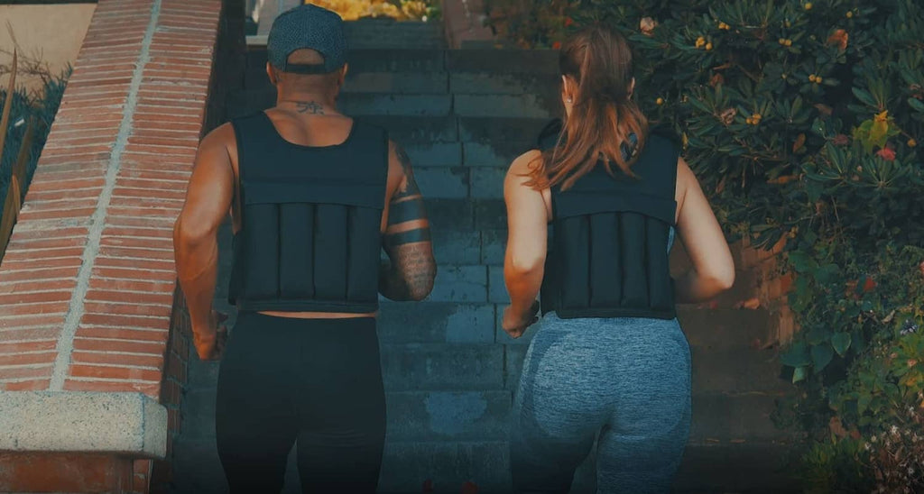 Black weighted vest worn from behind, back straps visible
