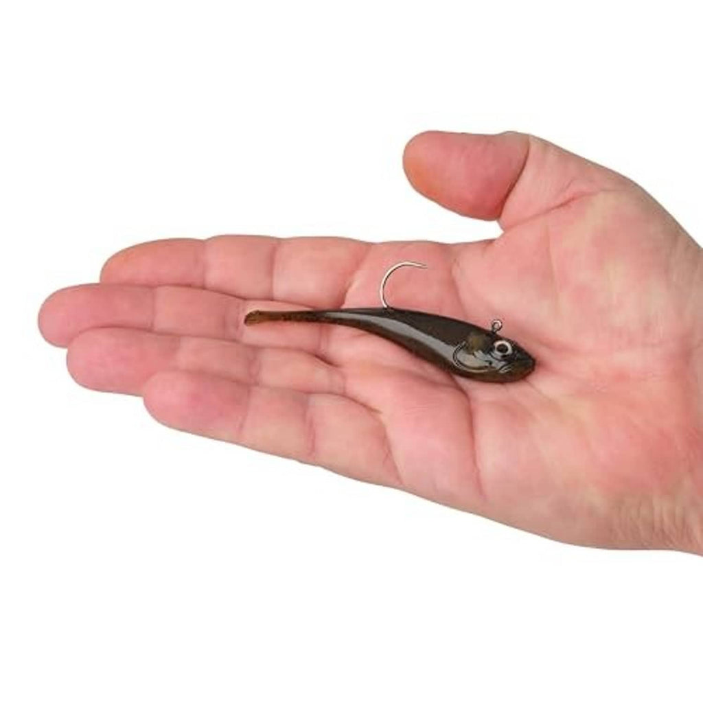 Green pumpkin soft plastic fishing lure held in hand with visible hook
