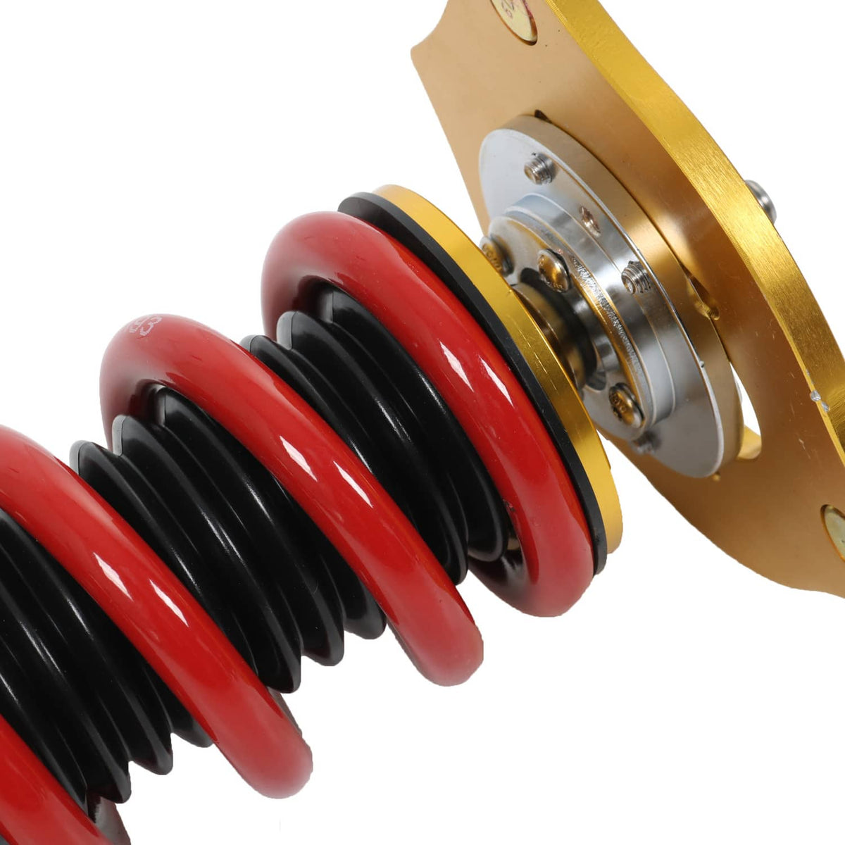 Coilover spring and top mount: red coils, black spring seats, and gold bracket plate