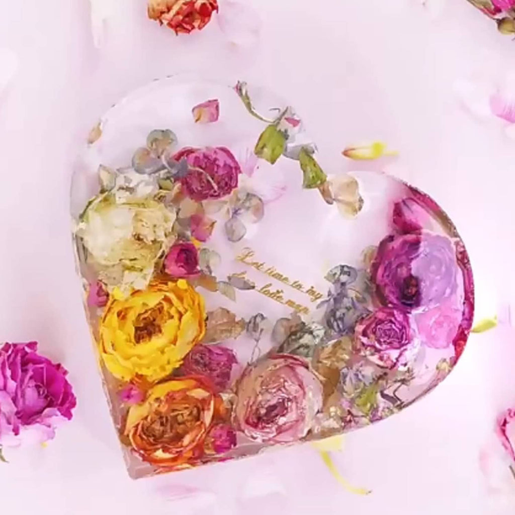 Heart resin piece with embedded dried flowers in a white heart mold