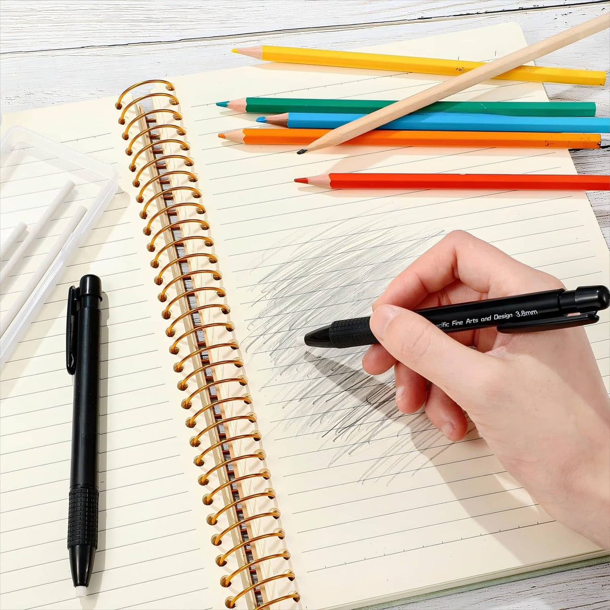 Black retractable eraser mechanical pen drawing sketch lines in notebook
