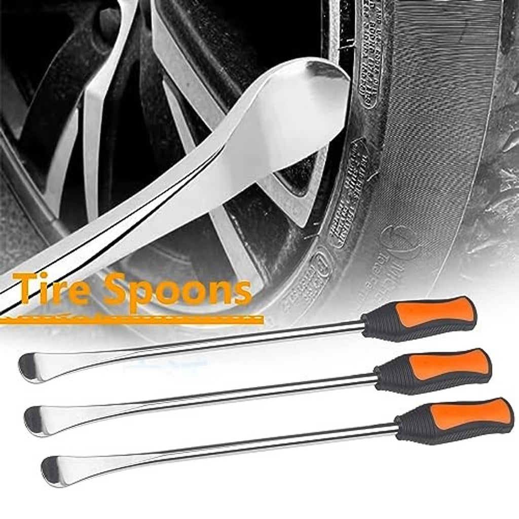 Tire changing spoon tools with black/orange handles shown by a wheel and tire
