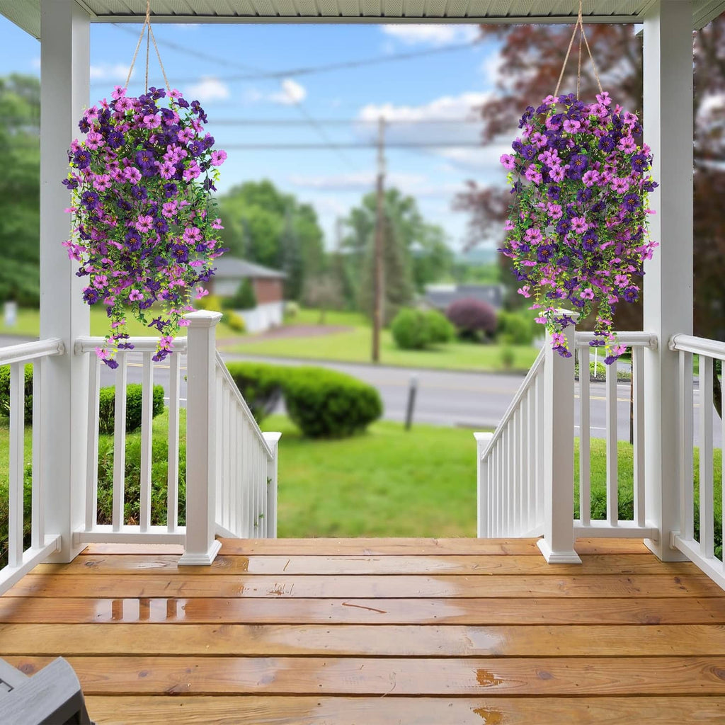 Purple and magenta hanging artificial flower baskets with layered faux blossoms