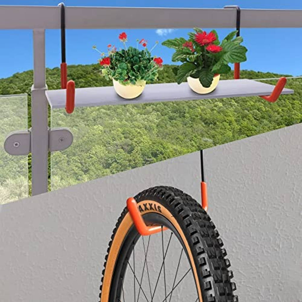 Orange bike hook end with black metal frame holding a wheel against a rail