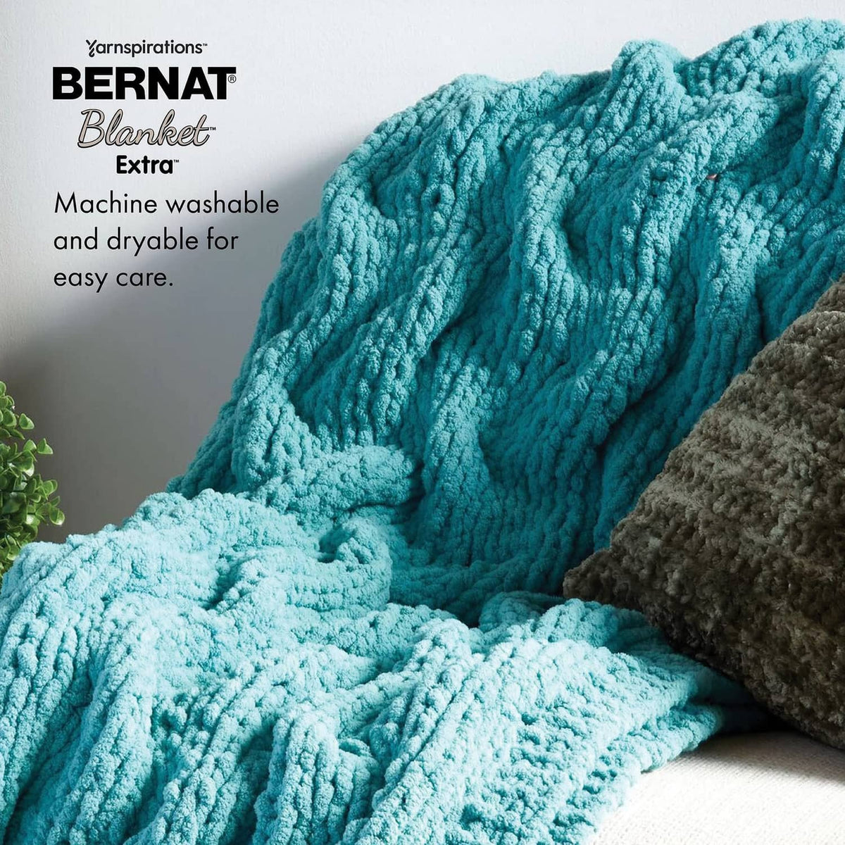 Jumbo chenille-style yarn skeins in bright aqua blue with thick ribbed texture