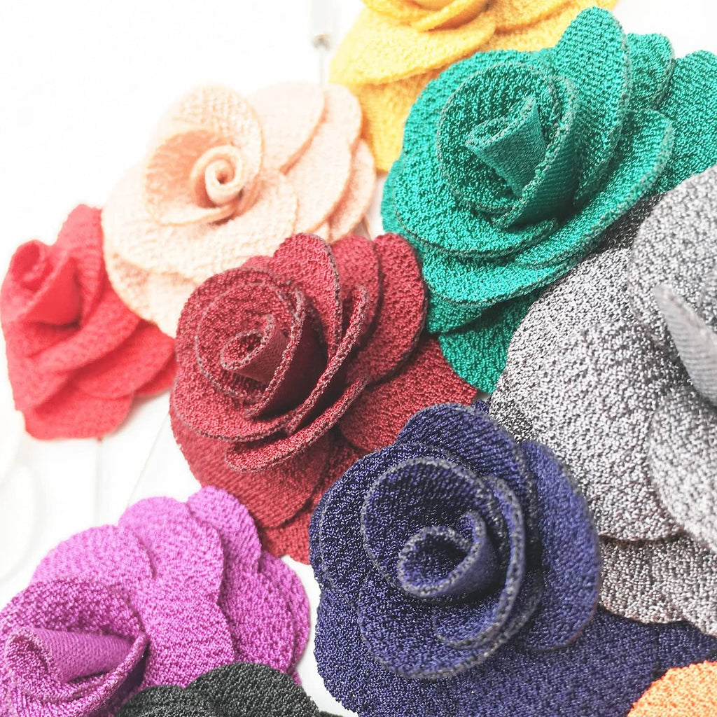 Handmade fabric rose lapel pins, mixed colors, close-up detail