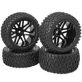Set of 4 black RC wheels with multi-spoke rims and knobby rubber tires