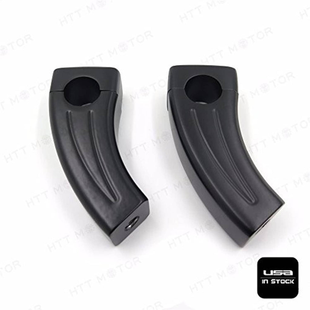 Black handlebar riser block pair showing circular opening and side grip grooves
