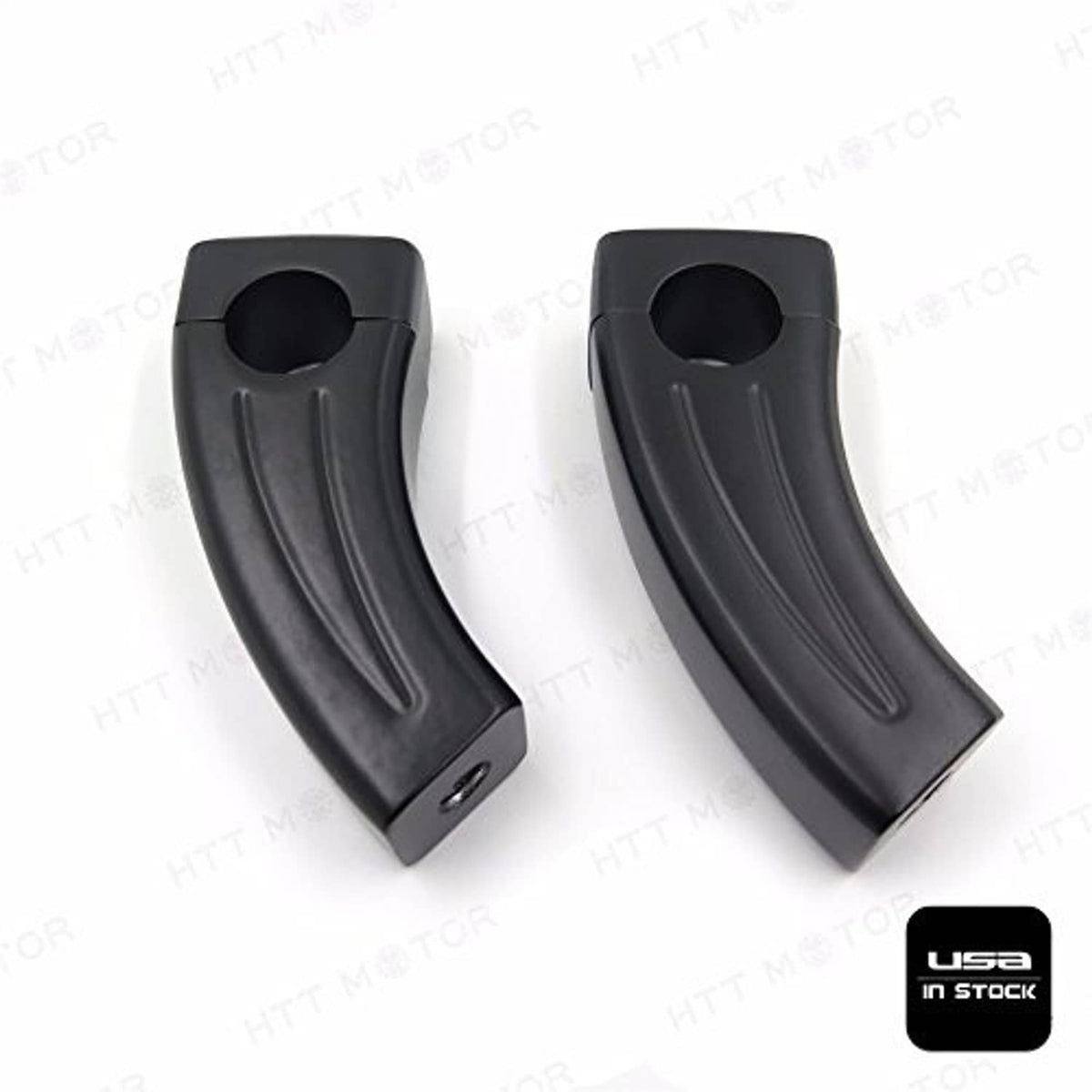 Black handlebar riser block pair showing circular opening and side grip grooves