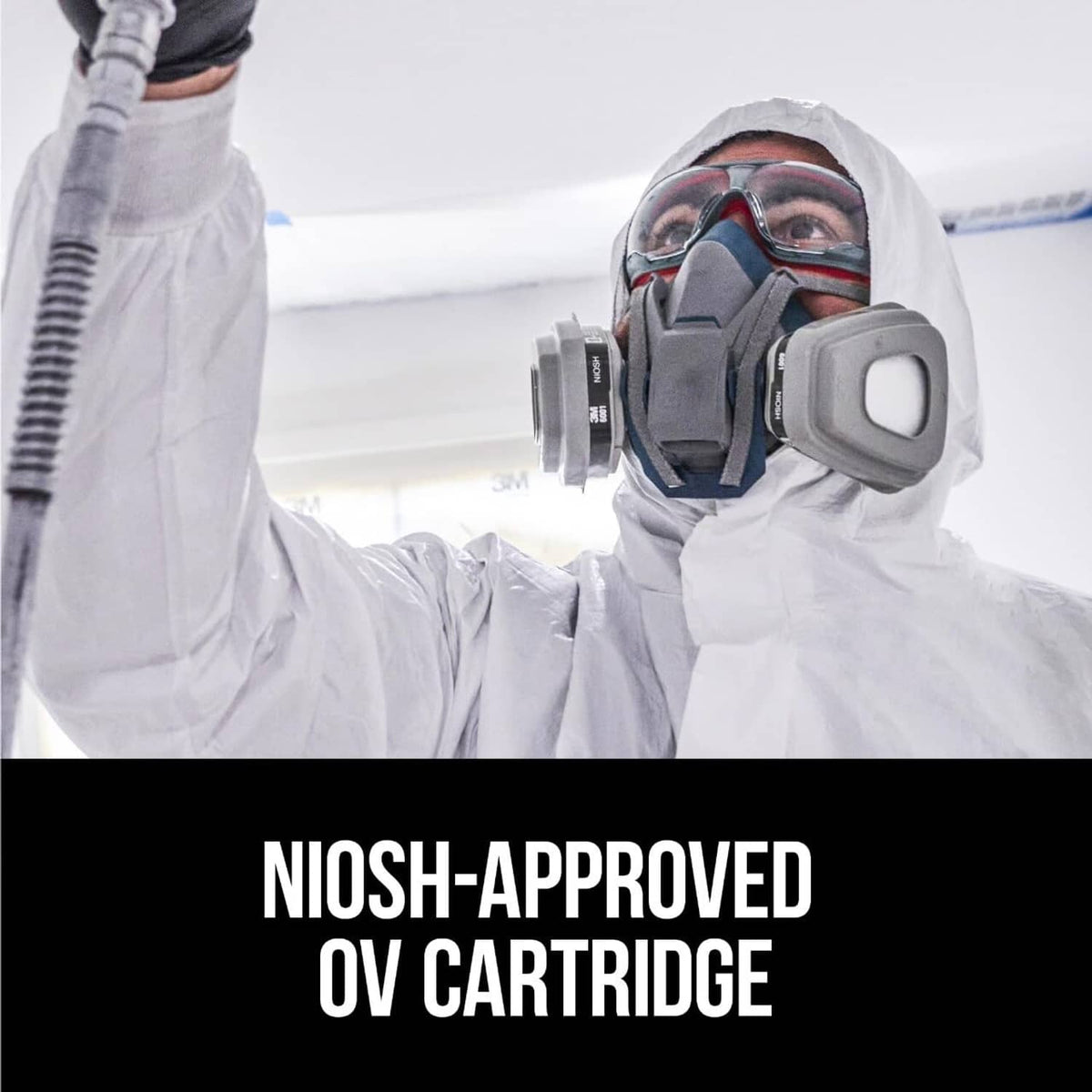 Respirator with gray organic vapor cartridge filters on a protective worker