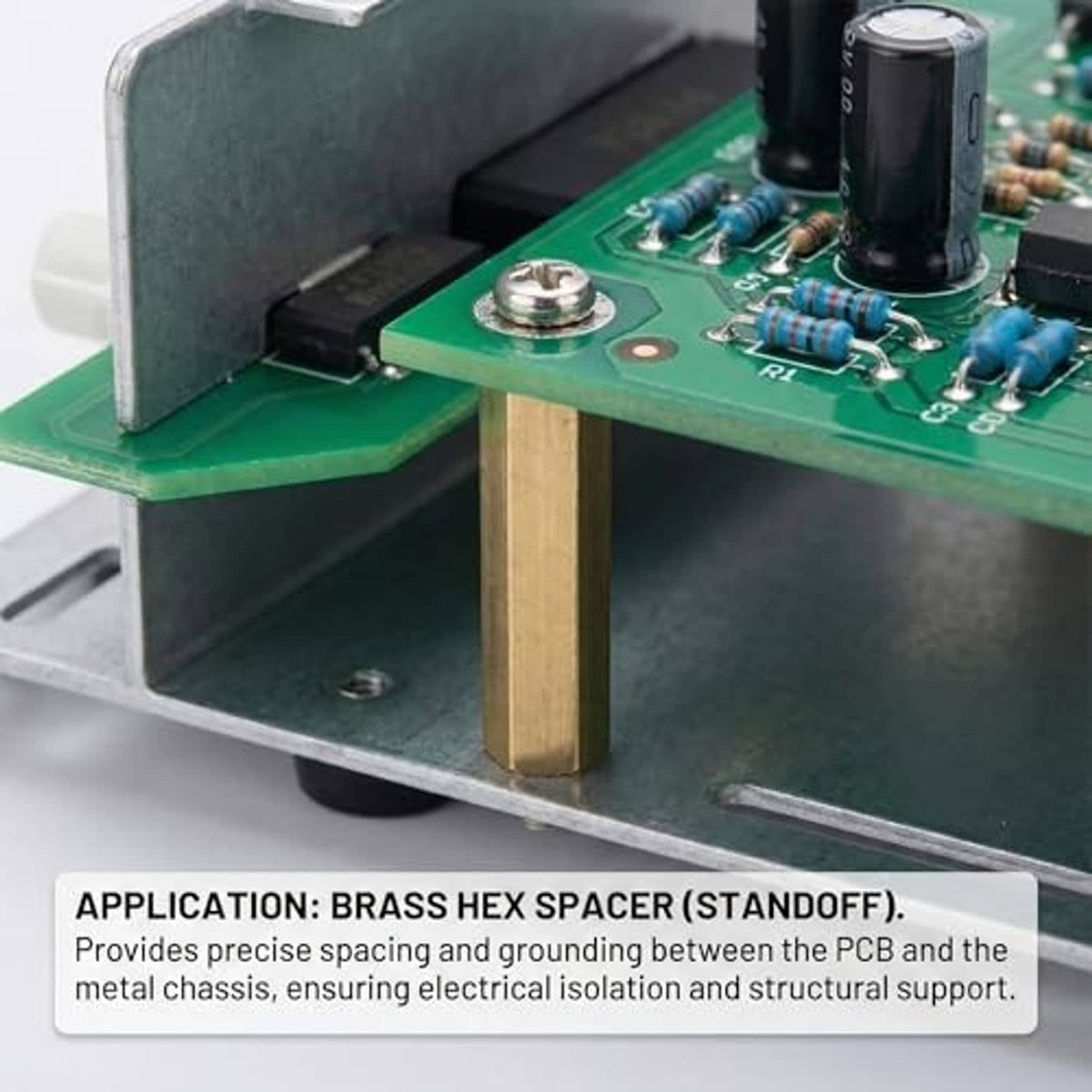 Brass hex nut spacer standing upright on a circuit board