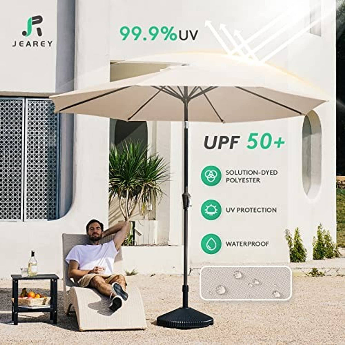 Beige patio umbrella open over outdoor seating with center pole