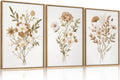 Set of 3 botanical flower canvas prints in beige tones with gold-tone wood frames