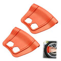 Set of two orange plastic rim protectors with oval cutouts for tire changing