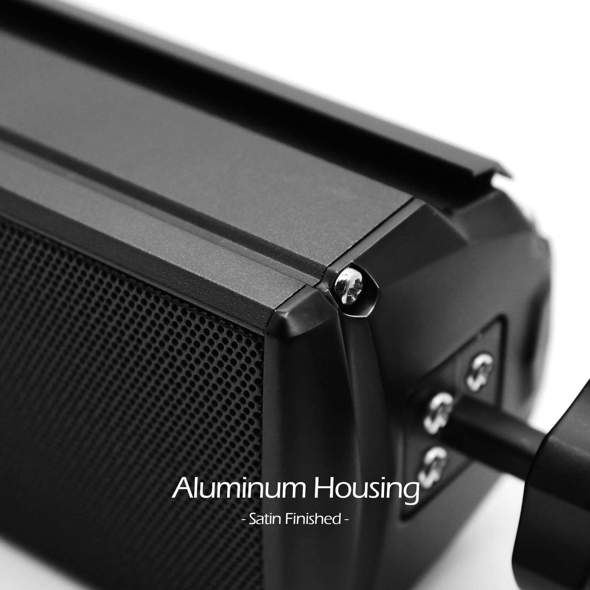 Black speaker with satin-finished aluminum housing and textured front grille.