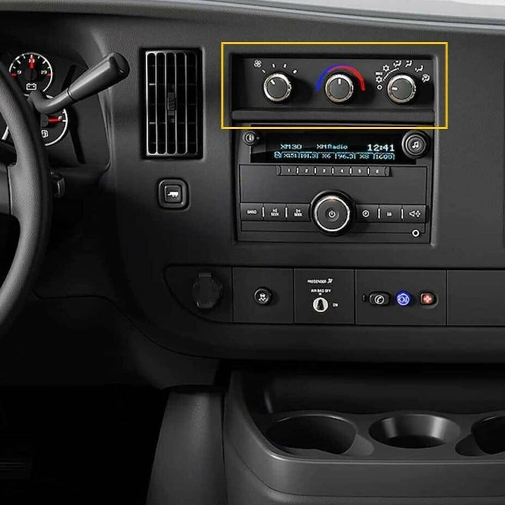 Dashboard HVAC area featuring black temperature control knobs with silver-edged faces