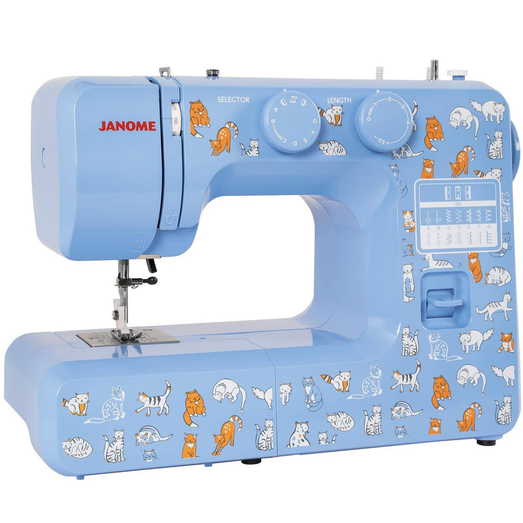 Blue Janome sewing machine, angled view with cat decals and top control dials