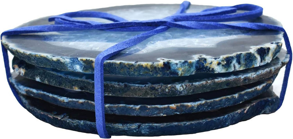 Stacked blue agate geode coasters with polished banded layers and blue ribbon
