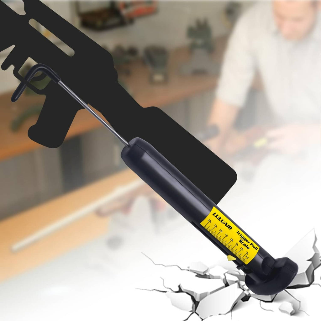 Black manual pull scale with yellow inch markings and bent hook, shown in use