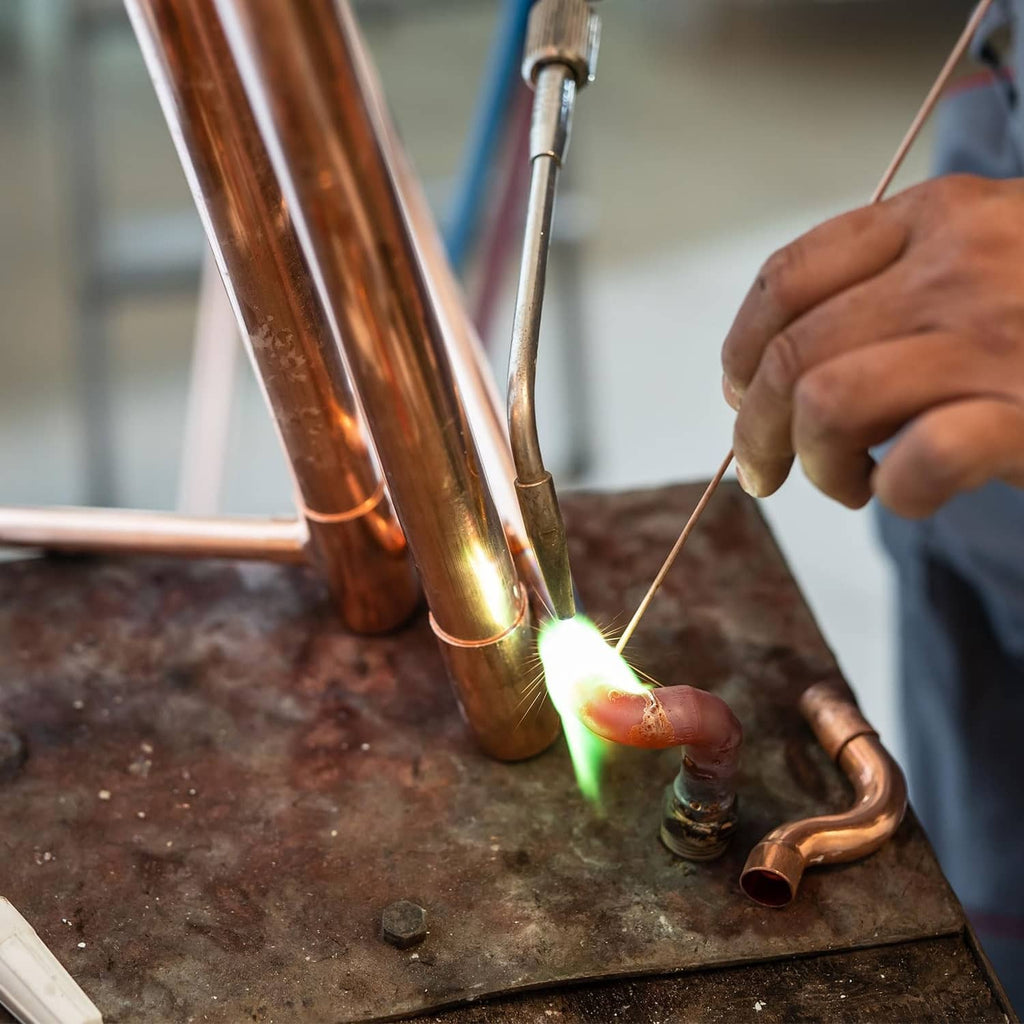 Copper pipe end caps installation near soldered copper pipe ends