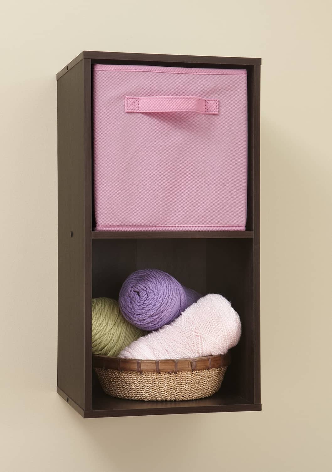 Pink fabric cube drawer with handle, shown open in a storage cube