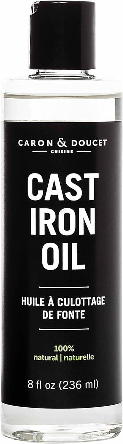 Caron & Doucet Cast Iron Oil bottle, 8 fl oz (236 ml), black cap and dark label.